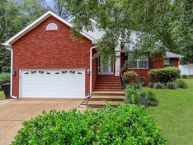 view of front of house featuring a garage and a front yard