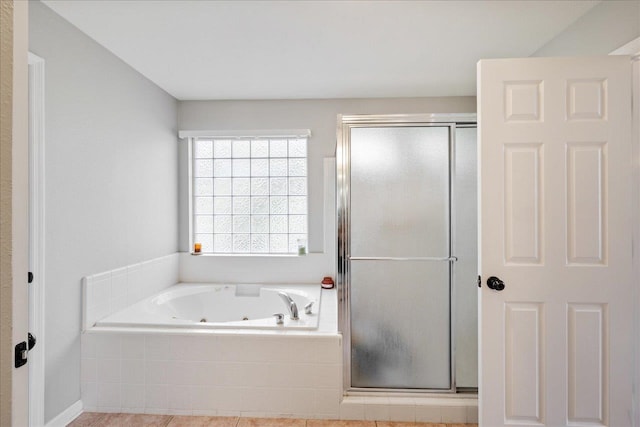 bathroom with tile patterned floors and separate shower and tub