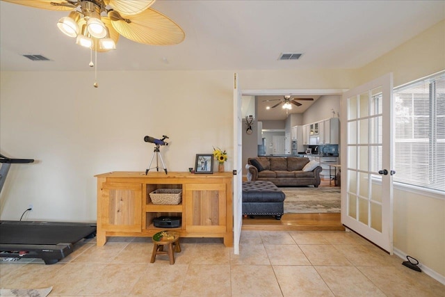 interior space featuring french doors and light tile patterned floors