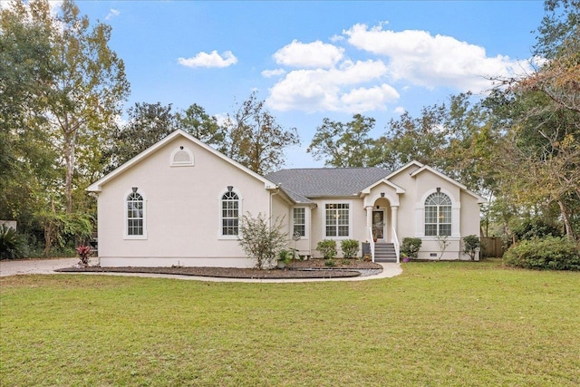 ranch-style home with a front yard