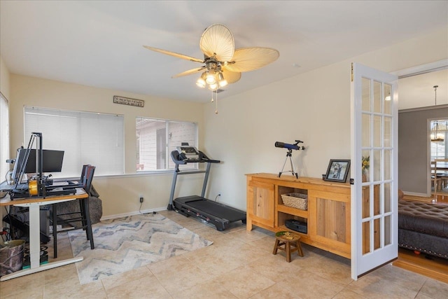 office with french doors and ceiling fan