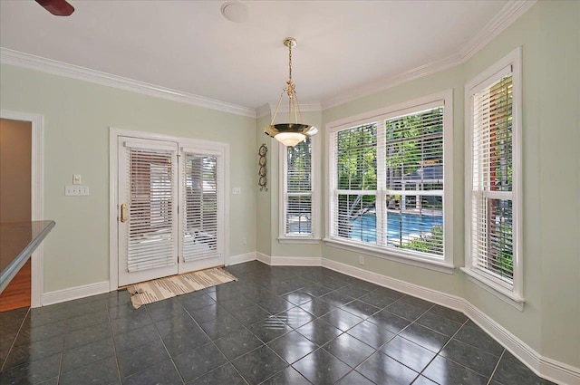 unfurnished dining area with baseboards and ornamental molding