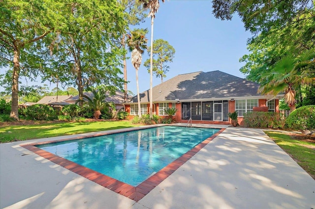outdoor pool with a yard