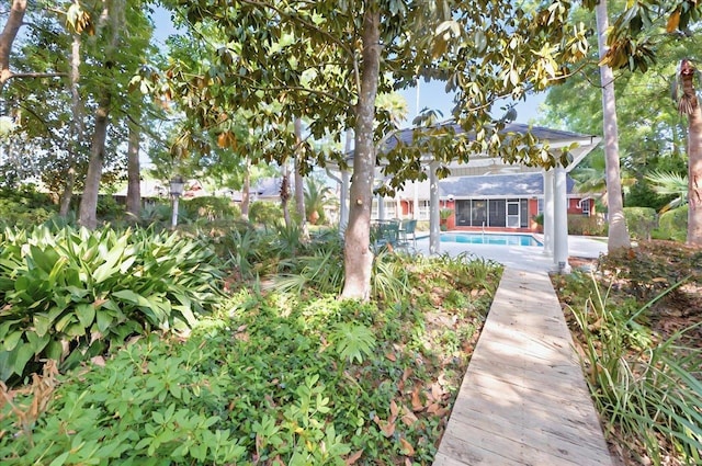 view of yard with an outdoor pool