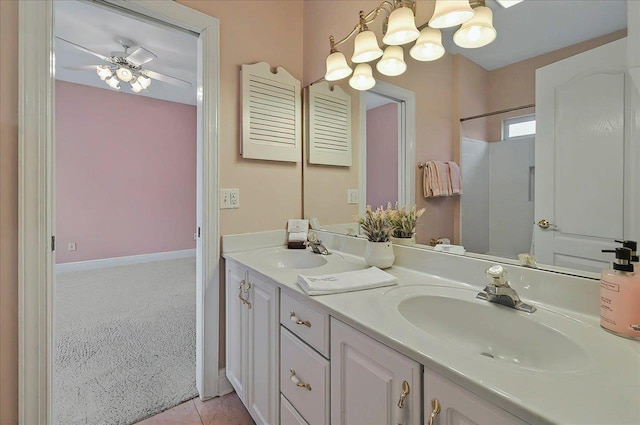 bathroom with double vanity, a sink, and a chandelier