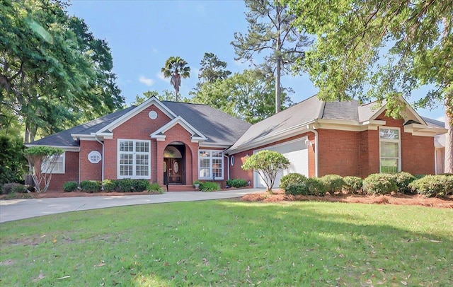 single story home with a garage, a front yard, driveway, and brick siding