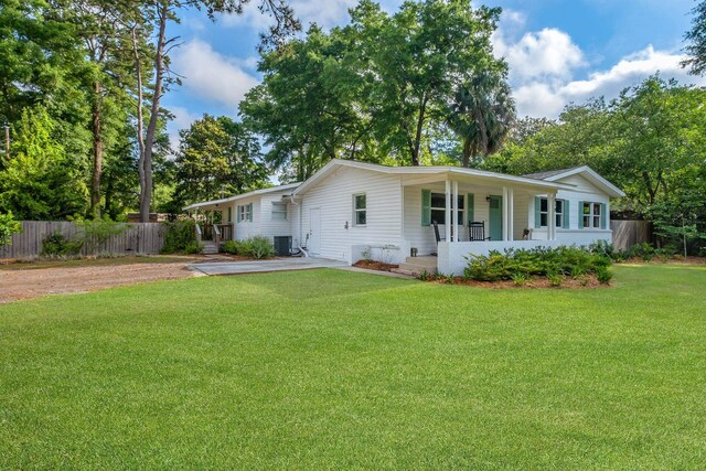 1818 Homewood Rd, Tallahassee, FL 32303 - view of front of house with central AC, a porch, and dirt driveway