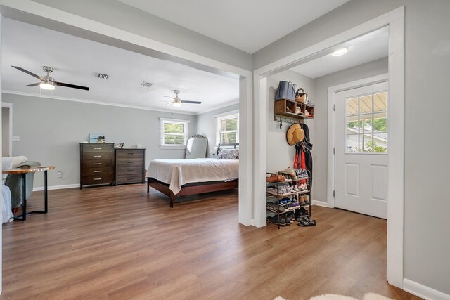 1818 Homewood Rd, Tallahassee, FL 32303 - bedroom featuring wood finished floors, baseboards, crown molding, and ceiling fan