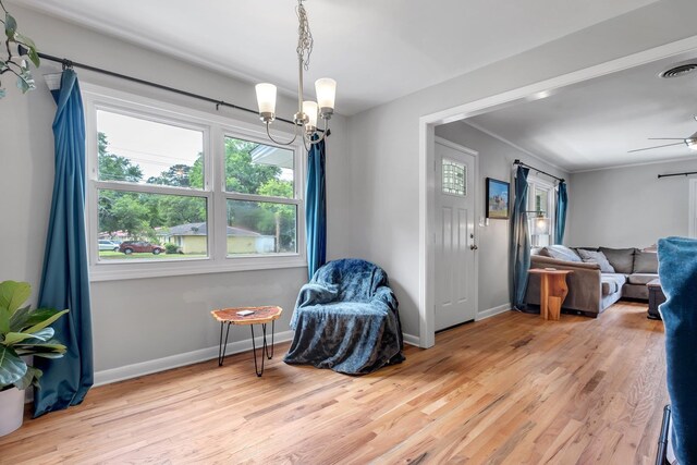 1818 Homewood Rd, Tallahassee, FL 32303 - living area featuring plenty of natural light, wood finished floors, a chandelier, and baseboards