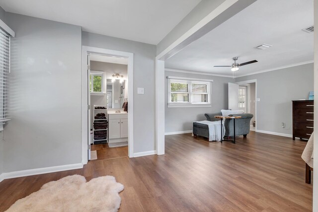 1818 Homewood Rd, Tallahassee, FL 32303 - bedroom with multiple windows, wood finished floors, baseboards, and crown molding
