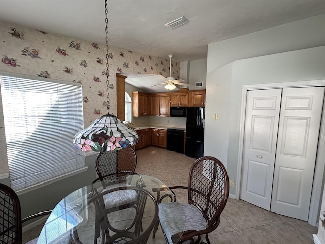 dining space with visible vents, baseboards, a ceiling fan, and wallpapered walls