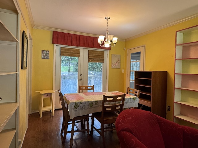 914 Carraway St, Tallahassee, FL 32308 - dining space with french doors, dark wood finished floors, a chandelier, and ornamental molding