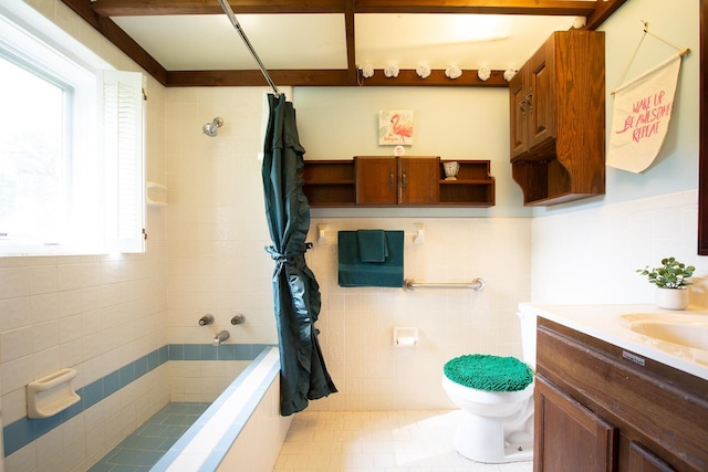 bathroom with vanity, tile patterned floors, toilet, and tile walls