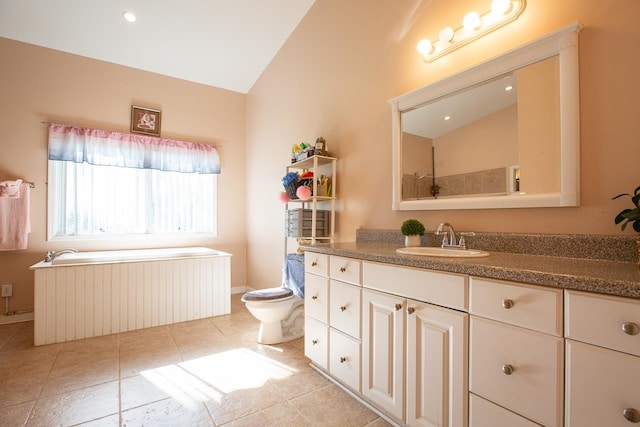 bathroom featuring tile patterned flooring, vanity, toilet, and vaulted ceiling