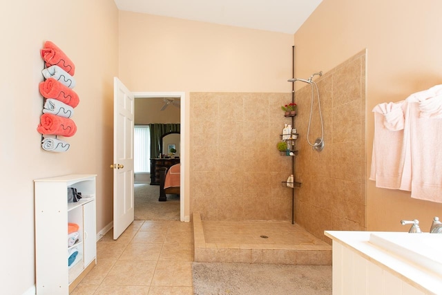 bathroom featuring tiled shower and tile patterned floors