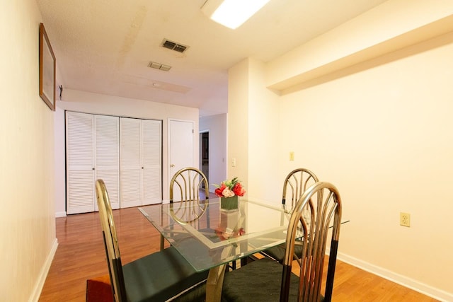 dining space featuring light hardwood / wood-style flooring