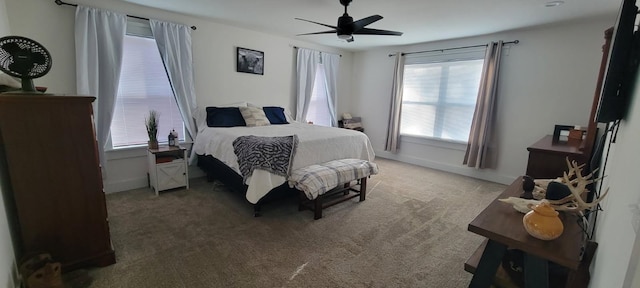 bedroom with ceiling fan and carpet floors