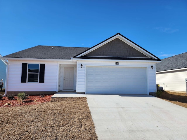 ranch-style home featuring a garage