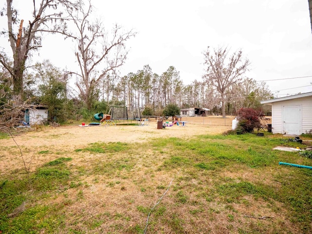 view of yard featuring a trampoline