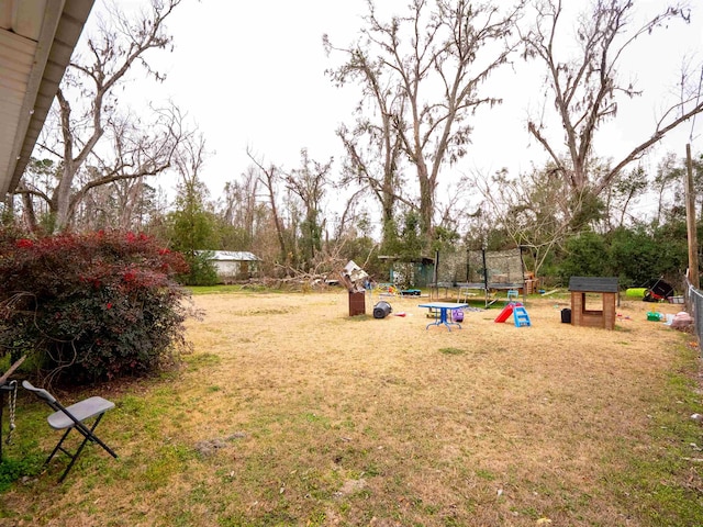 view of yard featuring a trampoline