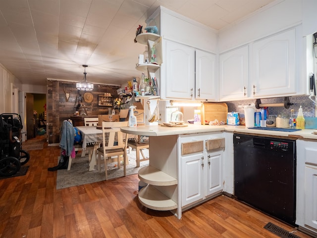 kitchen with white cabinetry, black dishwasher, hardwood / wood-style floors, and pendant lighting