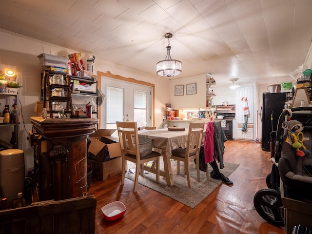 dining area featuring hardwood / wood-style flooring and french doors