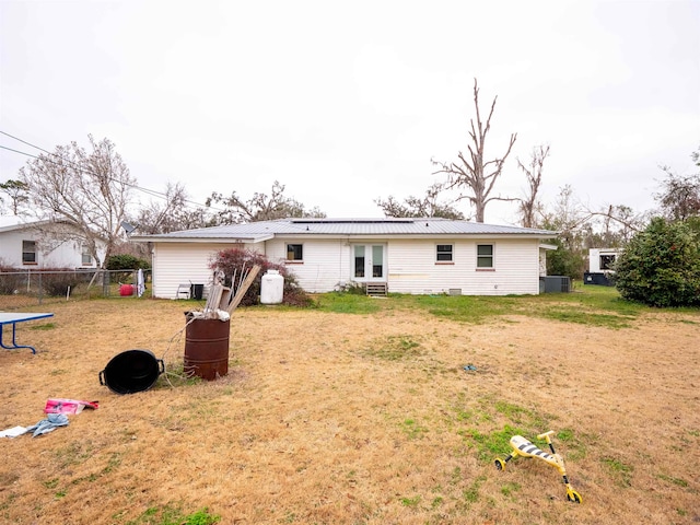 rear view of property with a yard and french doors