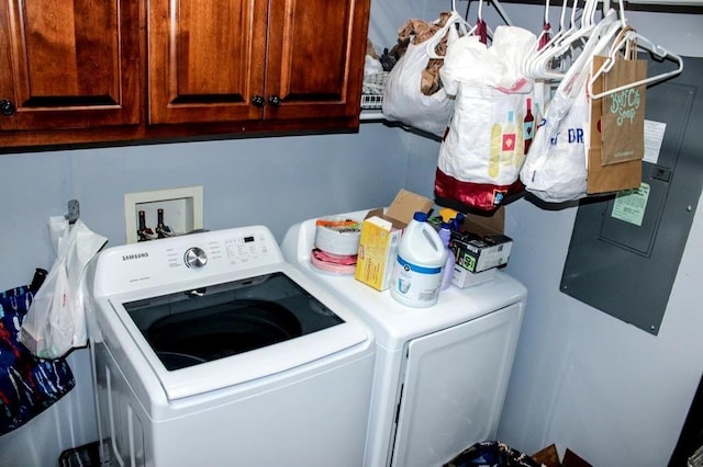 laundry room with cabinets and washing machine and dryer