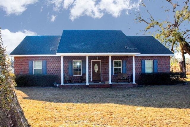 view of front facade with a porch and a front lawn