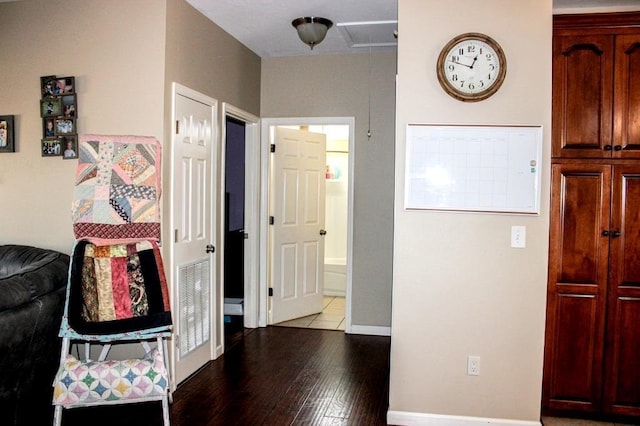 corridor with hardwood / wood-style floors