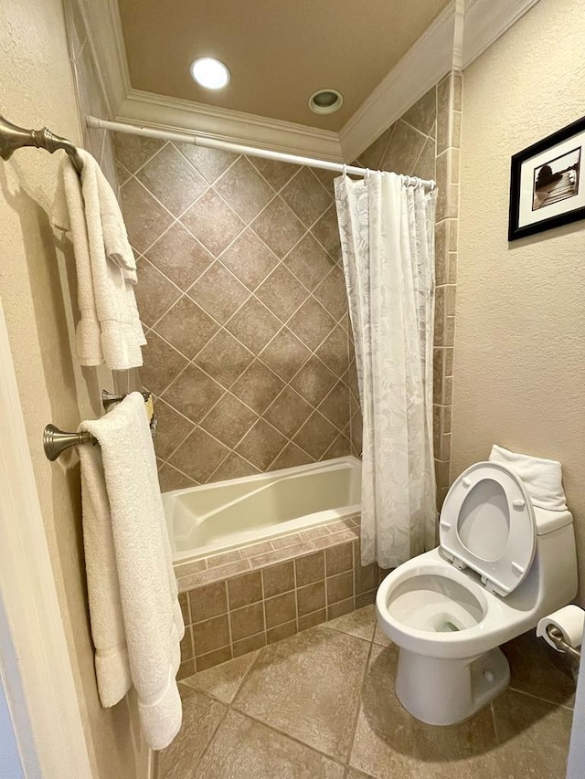 bathroom featuring ornamental molding, tile patterned floors, toilet, and shower / tub combo