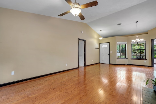 2825 Ohara Dr, Tallahassee, FL 32309 - unfurnished living room featuring a chandelier, lofted ceiling, ceiling fan, light wood-type flooring, and baseboards