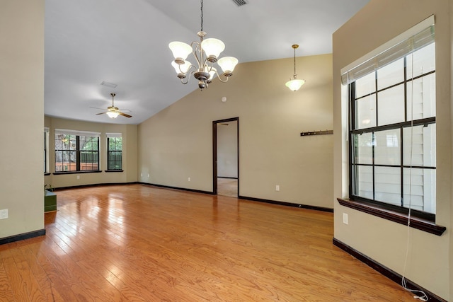 2825 Ohara Dr, Tallahassee, FL 32309 - empty room featuring ceiling fan, a chandelier, vaulted ceiling, wood finished floors, and baseboards