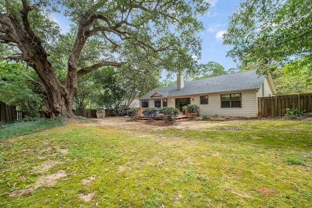2825 Ohara Dr, Tallahassee, FL 32309 - back of property with a chimney and a deck