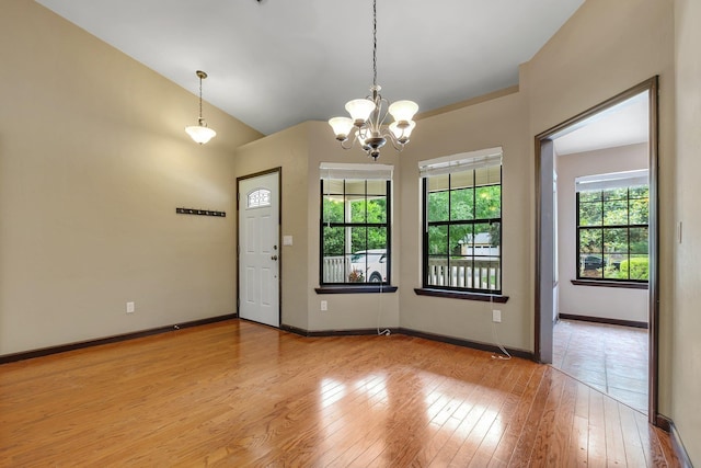 2825 Ohara Dr, Tallahassee, FL 32309 - spare room with a chandelier, hardwood / wood-style flooring, and baseboards