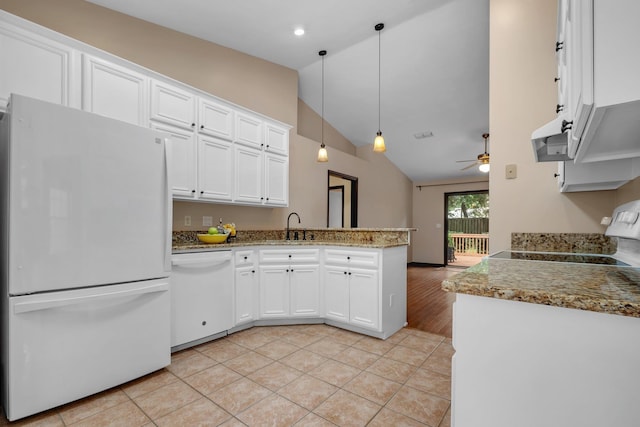 2825 Ohara Dr, Tallahassee, FL 32309 - kitchen featuring white appliances, a peninsula, vaulted ceiling, white cabinetry, and a sink