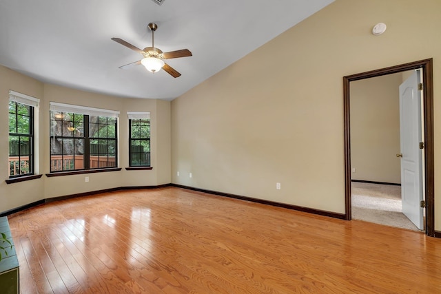 2825 Ohara Dr, Tallahassee, FL 32309 - empty room featuring plenty of natural light, vaulted ceiling, ceiling fan, a smoke detector, and wood finished floors