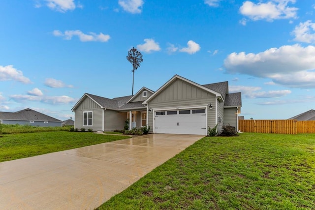 view of front of house featuring a front lawn and a garage