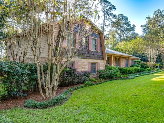 view of home's exterior featuring a lawn