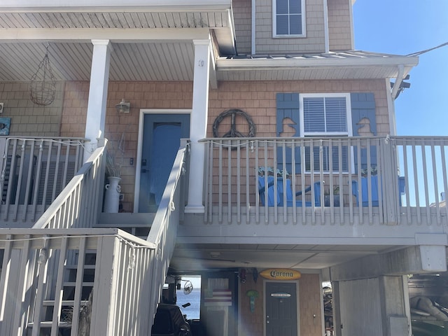 entrance to property with a balcony