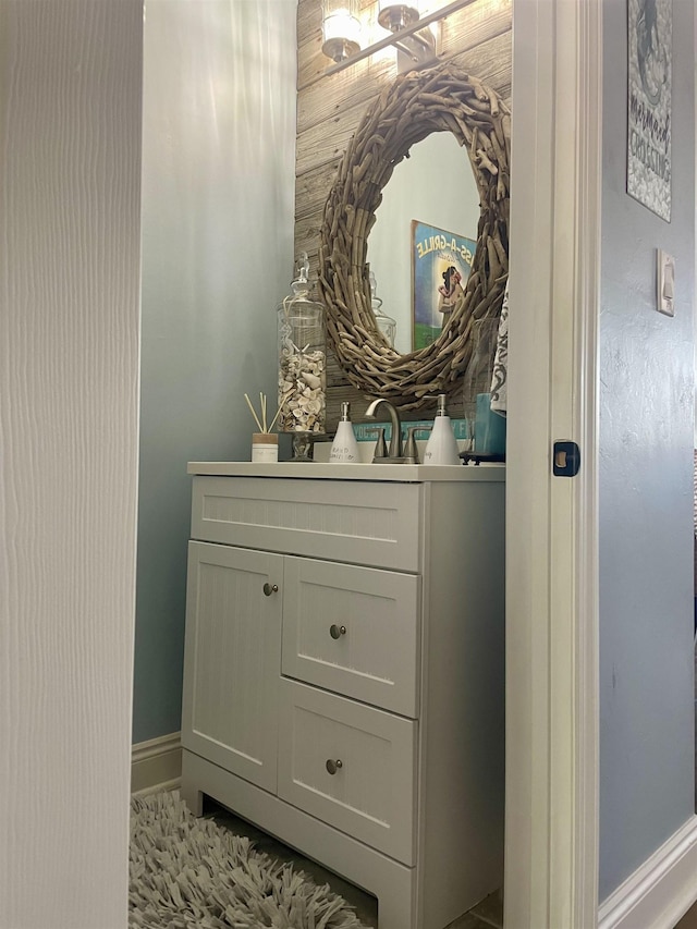 bathroom with vanity and baseboards