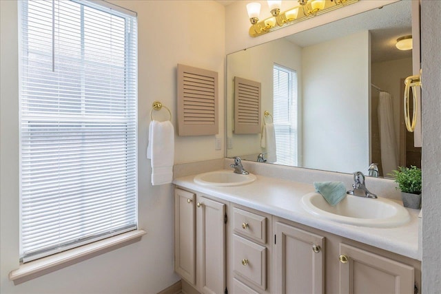 full bath with double vanity and a sink