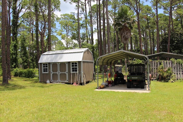 view of outbuilding with a carport and a yard