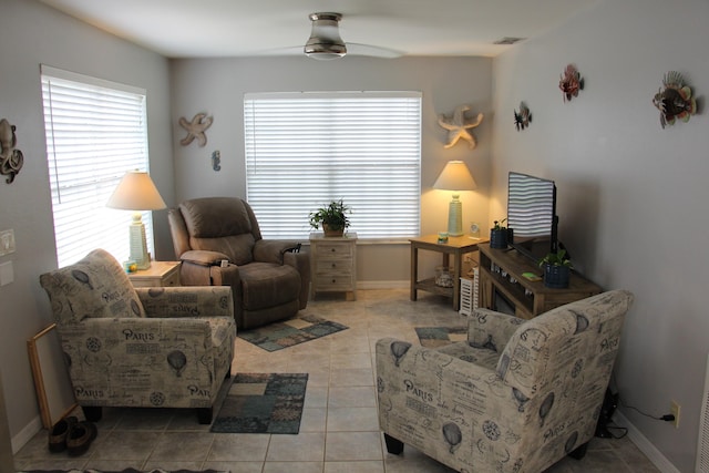 living room featuring tile patterned floors and ceiling fan