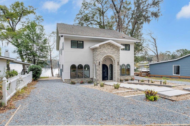 view of front of house featuring a water view