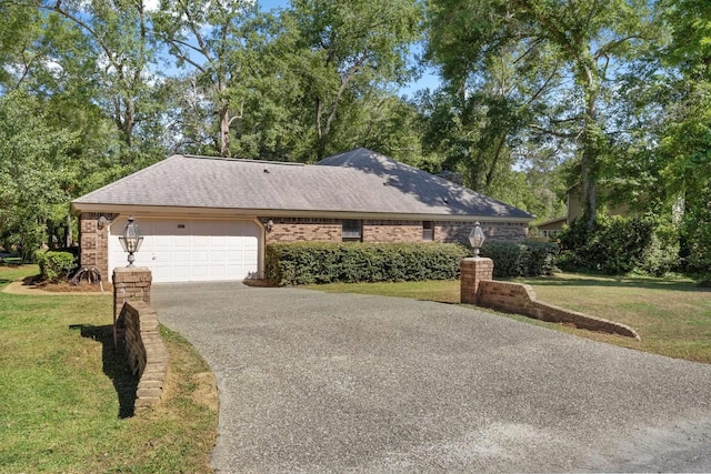 4601 Killimore Ln, Tallahassee, FL 32309 - ranch-style house featuring an attached garage, asphalt driveway, a front yard, brick siding, and a shingled roof