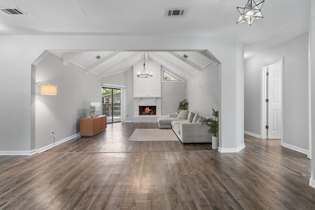 4601 Killimore Ln, Tallahassee, FL 32309 - living room featuring dark wood finished floors, baseboards, a chandelier, and a brick fireplace
