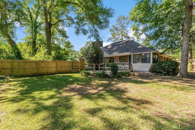 4601 Killimore Ln, Tallahassee, FL 32309 - rear view of house with a chimney and a wooden deck