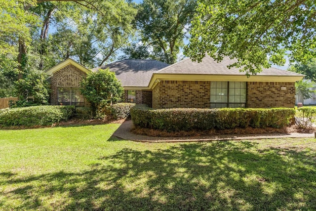 4601 Killimore Ln, Tallahassee, FL 32309 - ranch-style house with brick siding and a front yard