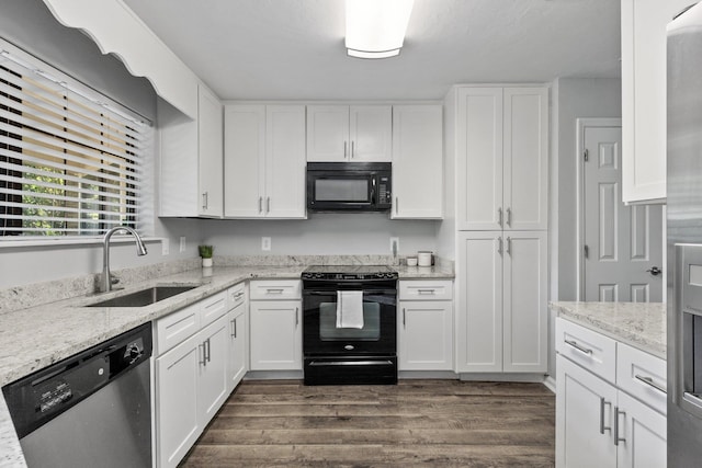 4601 Killimore Ln, Tallahassee, FL 32309 - kitchen with black appliances, a sink, and white cabinetry